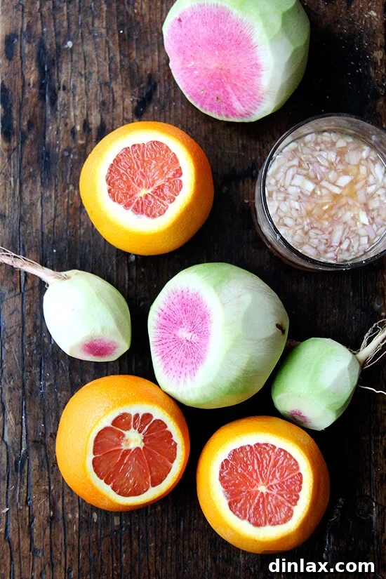 Vibrant Watermelon Radish, Orange, and Goat Cheese Salad 3 Thinly sliced watermelon radishes and segmented Cara Cara oranges arranged artfully.