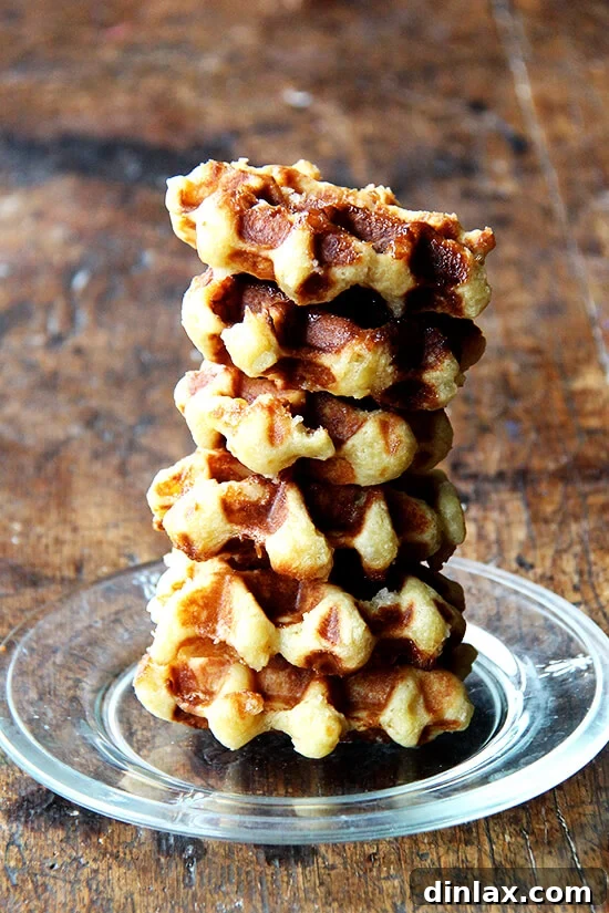 From Juicer Broths to Liege Waffles and Swedish Snack Bread 3 A delicious stack of golden-brown Liege waffles, caramelized with pearl sugar and radiating warmth, perfect for a delightful treat.