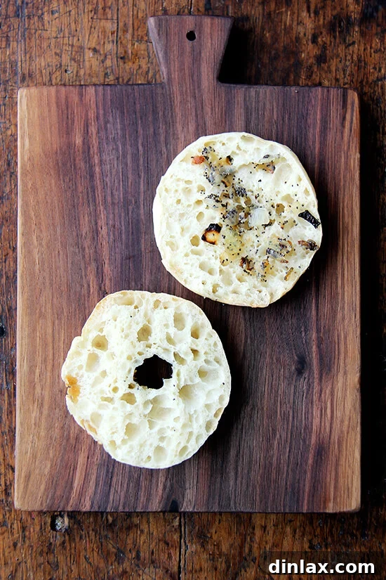 Your Guide to Perfect Homemade Bialys 16 A halved bialy, ready for toppings, showcasing its light and airy interior.