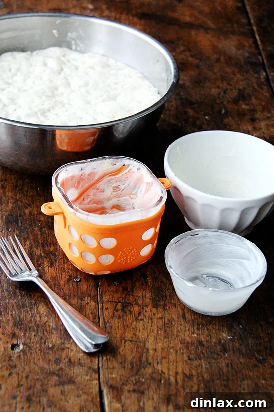 Various dishes including a glass storage container, a ceramic bowl, and a ramekin, ready for the bread bowl experiment.