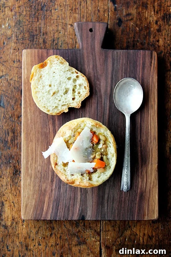 A bread bowl filled with the slow-cooked flageolet beans, ready to be enjoyed.