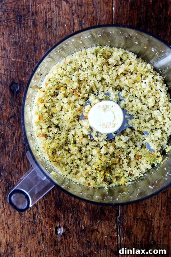Freshly prepared herbed breadcrumbs, featuring thyme, lemon zest, and garlic.