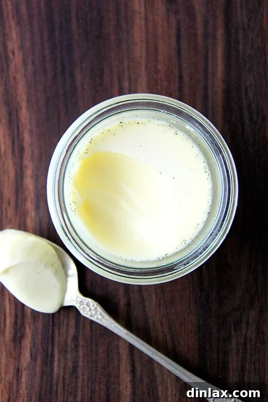 Vanilla Bean Pots de Crème: Velvety smooth, sweet, and deeply satisfying French custard dessert. Decadent Vanilla Bean Pots de Crème, a rich and creamy French custard dessert, garnished and ready to be enjoyed. Its smooth texture and deep vanilla flavor make it an unforgettable treat.