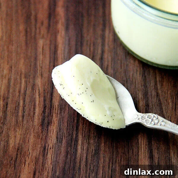 Individual serving of creamy Vanilla Bean Pots de Crème, garnished for an elegant presentation.