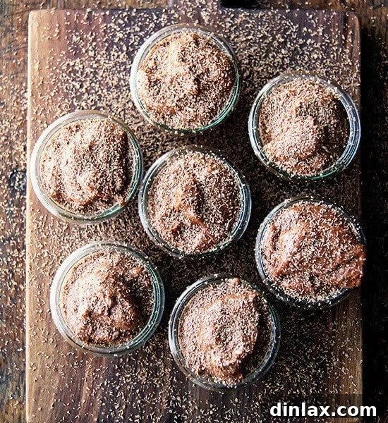 A top-down view of Julia Child's Chocolate Mousse, adorned with chocolate shavings, ready to be served in individual portions.