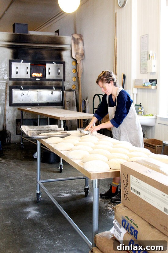 Fresh Threads of Vergennes 12 Julianne, co-owner of Vergennes Laundry, expertly shaping loaves of artisanal bread