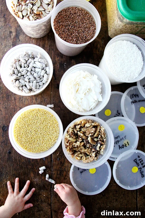 A charming close-up of a child's hand reaching into a container filled with date pellets, hinting at the irresistible appeal of healthy snacks.