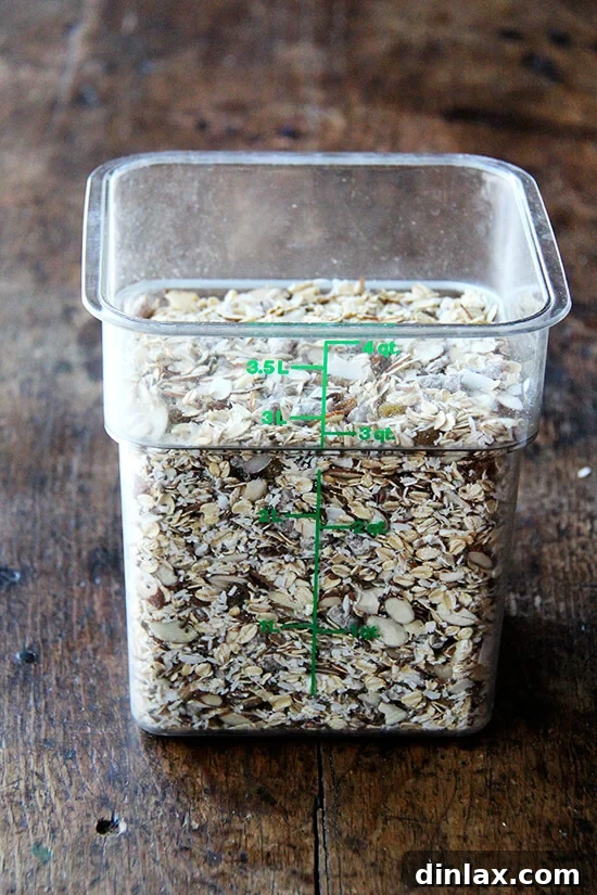 A large transparent container filled with a generous quantity of homemade muesli mix, ready for convenient use over several weeks.