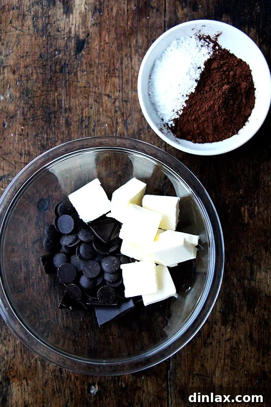 Mastering Chocolate Swirl Babka 5 Ingredients for the chocolate filling, including melted chocolate, butter, cocoa powder, and confectioners' sugar, ready to be combined.