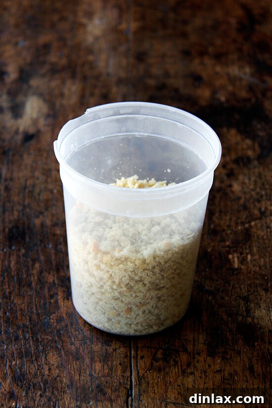 Homemade dried breadcrumbs stored in an airtight container.