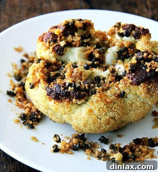 The finished Whole-Roasted Cauliflower with Fried Capers and Brown Butter Breadcrumbs, presented beautifully.