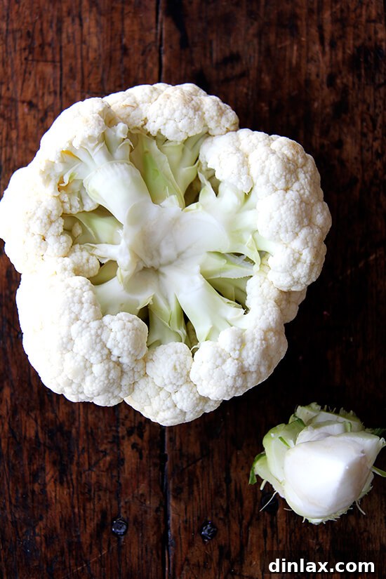 Cauliflower with its core carefully removed, prepared for roasting.