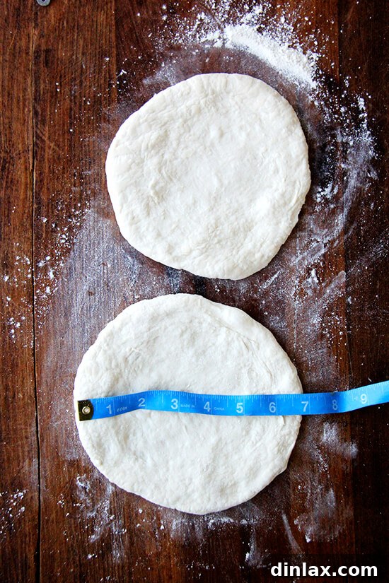 Six to seven-inch rounds of pizza dough, perfectly rolled and prepared to be filled and folded into savory calzones.