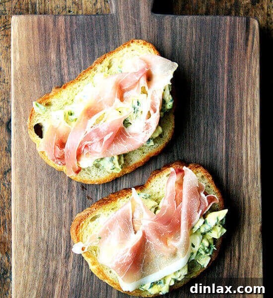 A vibrant bowl of pickled egg salad, rich in color and texture, presented with fresh herbs.