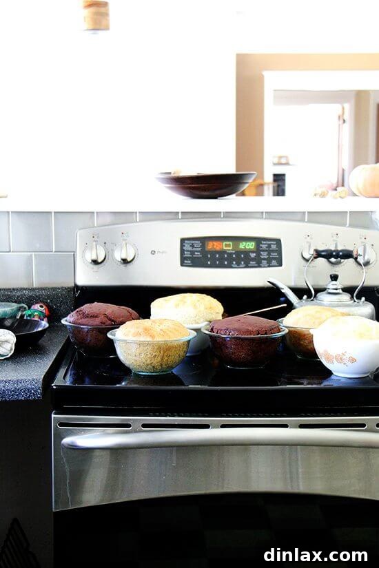 A perfectly baked loaf of peasant bread, just out of the oven, its golden-brown crust glistening and ready to cool.