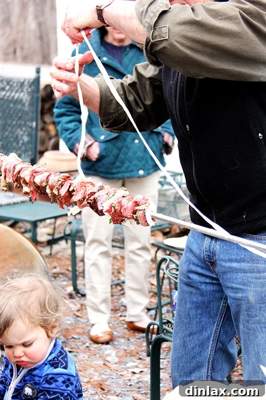 The traditional Greek kokoretsi, expertly wrapped and ready to be slow-roasted on the spit alongside the lamb.