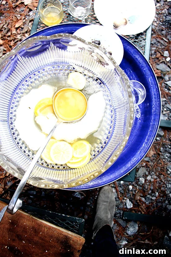 A festive punch bowl, nearly empty after a day of lively Greek Easter celebrations, perfectly complementing the feast.