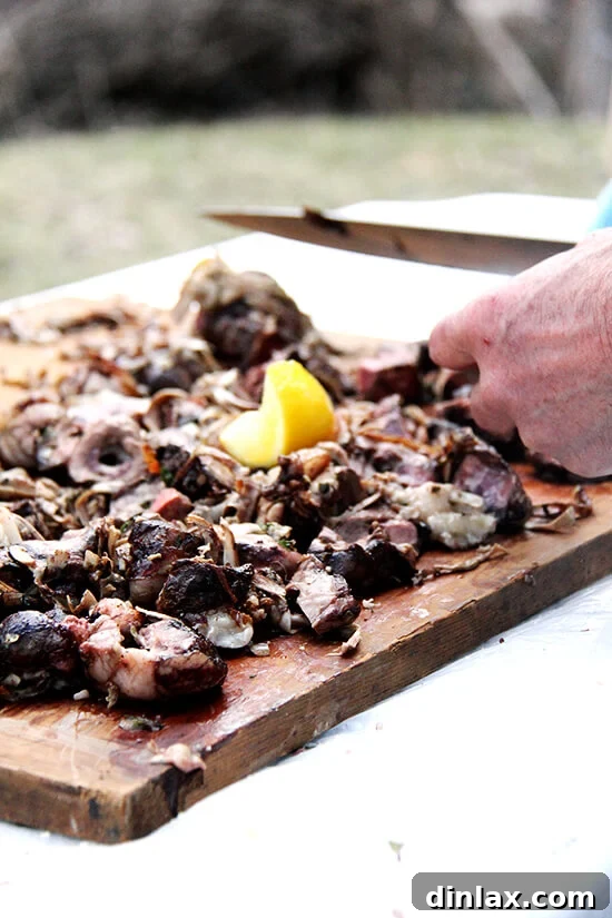 A close-up of the perfectly cooked kokoretsi, ready to be sliced and enjoyed, showcasing its rich texture and color.