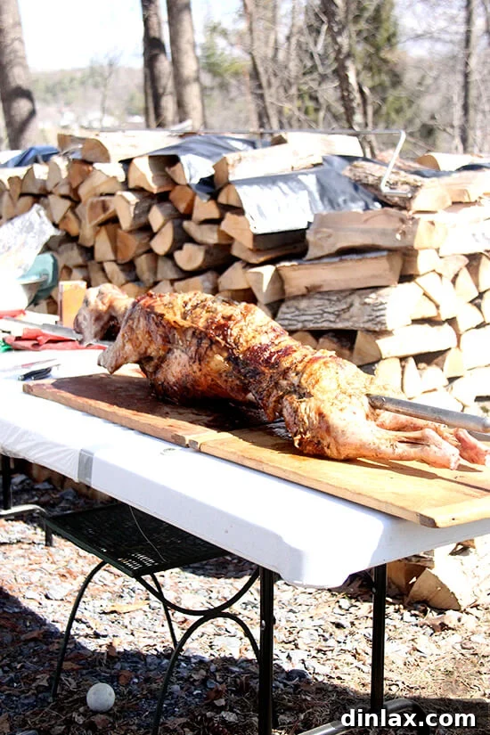 The majestic slow-roasted lamb, cooked to perfection, with crispy skin and tender meat, ready for the Easter feast.