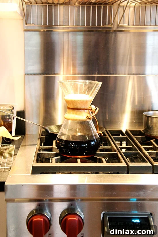 A Chemex coffee maker brewing a fresh, aromatic batch of coffee, perfect for winding down after the Greek Easter feast.