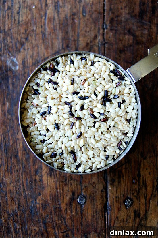 Uncooked rice blend measured out in a bowl, prepared for cooking.