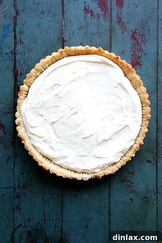 A fully assembled Strawberry Mascarpone Tart, garnished with fresh berries.