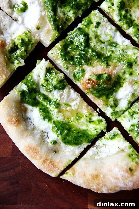 Ramp Pesto Pizza and Pickled Ramps 2 Freshly baked pesto pizza with burrata, drizzled with olive oil and topped with vibrant green ramp pesto.