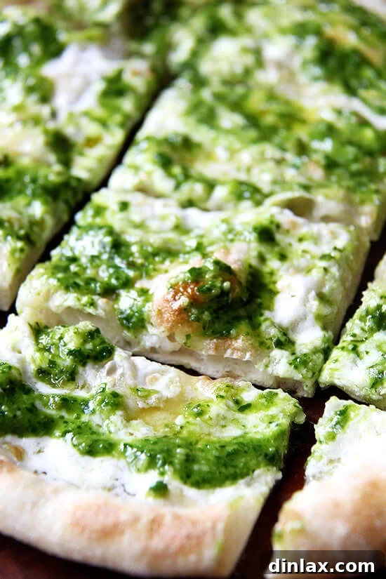 Ramp Pesto Pizza and Pickled Ramps 12 A delicious ramp green pesto and burrata pizza, sliced and ready to enjoy.