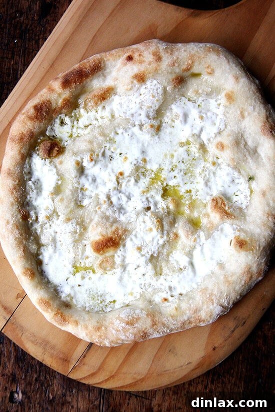 Ramp Pesto Pizza and Pickled Ramps 9 A freshly baked pizza, golden and bubbling, just out of the oven before pesto is applied.