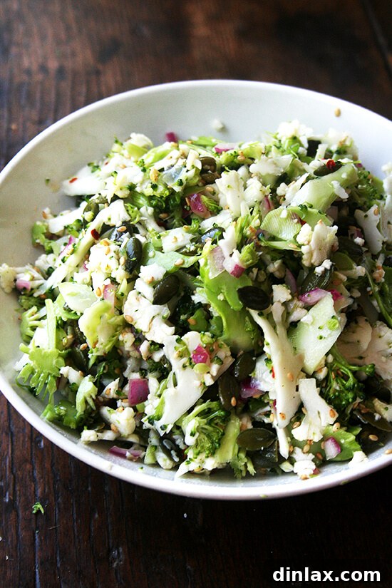 A healthy and vibrant raw cauliflower broccoli pepita salad, perfect for a light side dish.