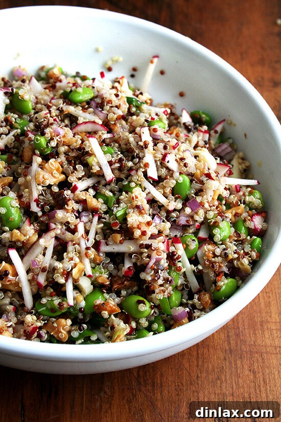 A nutritious quinoa salad featuring radishes, walnuts, and edamame, ideal as a light yet filling side.
