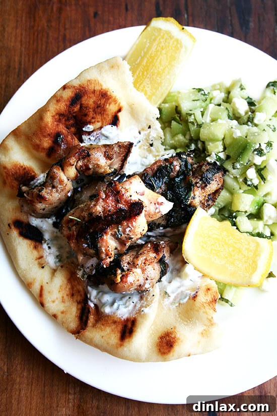 Grilled chicken souvlaki skewers served with refreshing tzatziki sauce and a crisp cucumber salad.