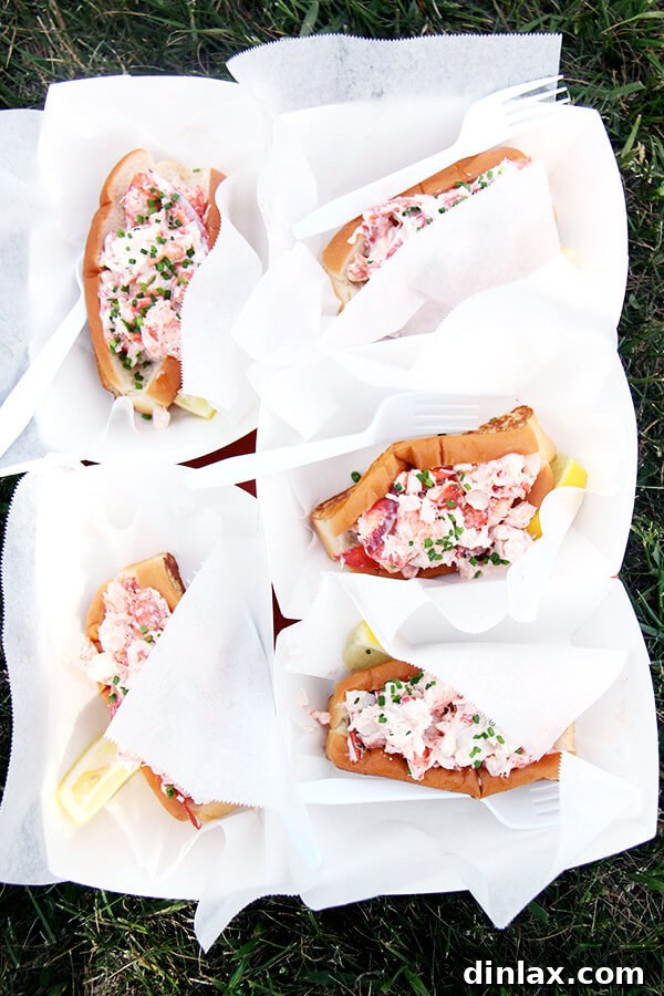 Two mouth-watering lobster rolls, perfectly prepared and ready to be enjoyed, from Bite Into Maine.