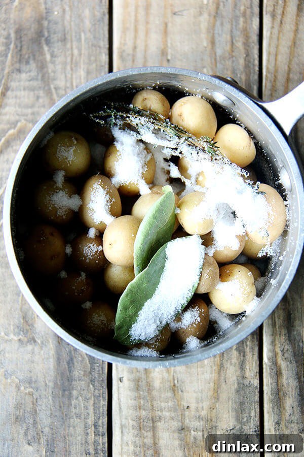 New potatoes seasoned with salt before cooking