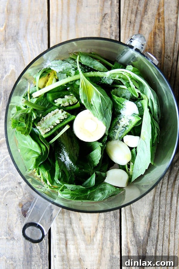 Ingredients for green harissa in a food processor