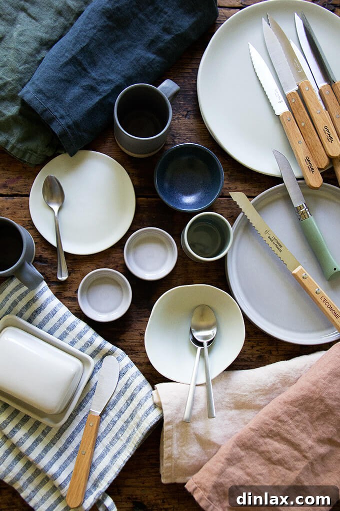 A diverse collection of food photography props, including rustic dishes, elegant cutlery, and textured linens, ready for styling.