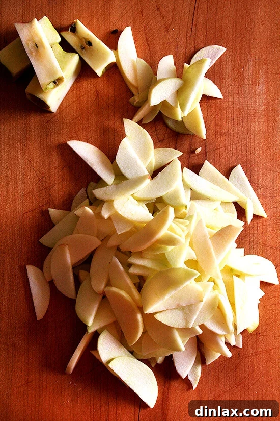 Thinly and uniformly sliced apples, prepared for the Bolzano Apple Cake batter.