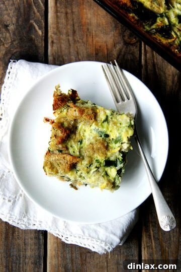 A golden-brown summer vegetable strata cooling on a wire rack.