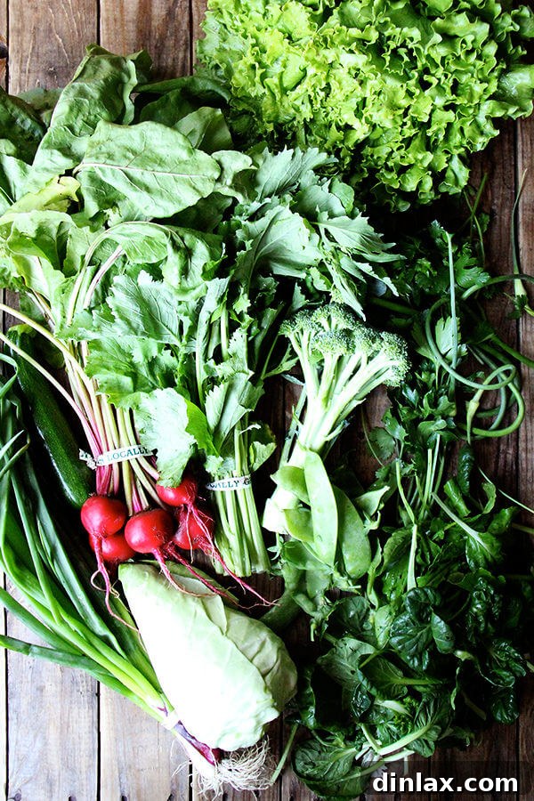 CSA week 3 haul: beets, lettuce, tatsoi, cone cabbage, mustard greens, scallions, parsley, cilantro, garlic scapes, snow peas, broccoli, zucchini.