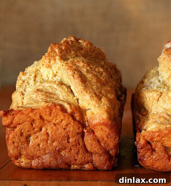 A freshly baked golden-brown loaf of homemade Beer Bread.