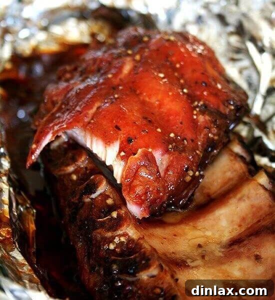 The ultimate easy oven-baked baby back ribs recipe, promising fall-off-the-bone tenderness and rich flavor.