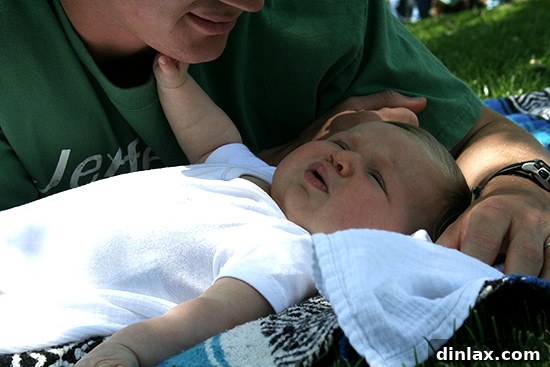 Rebeka, our little one, looking curiously at her surroundings, happily enjoying the sights and sounds of Solvang, making the family trip even more special and heartwarming.