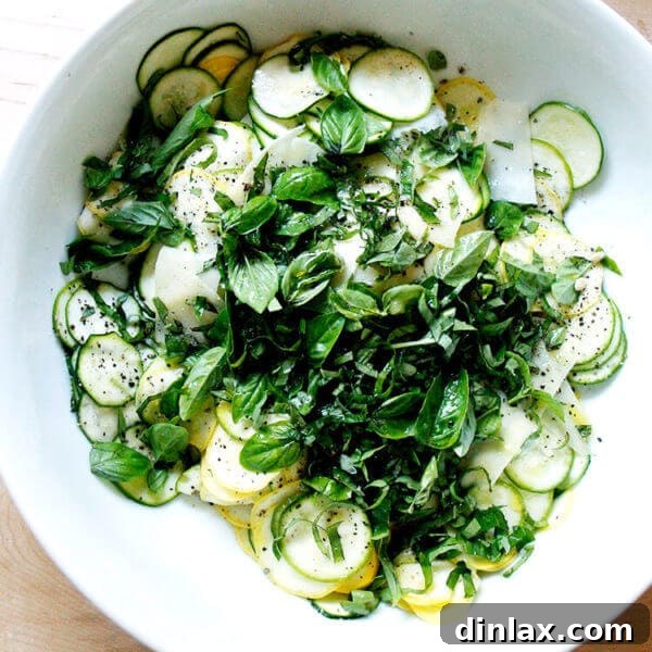 Vibrant raw summer squash salad with fresh herbs and Pecorino cheese.