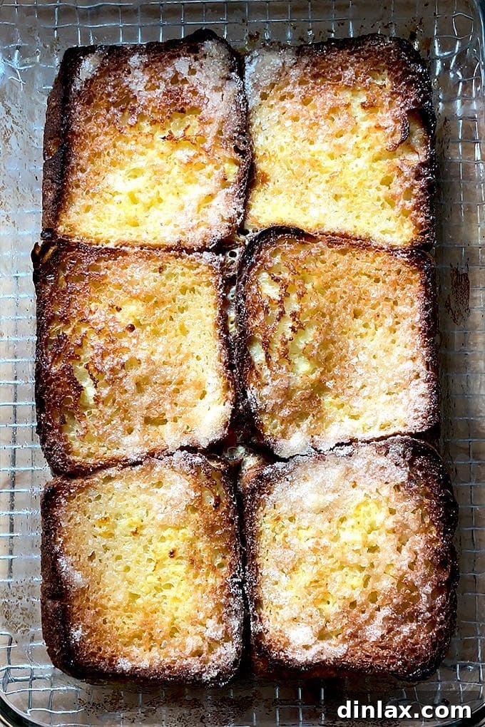 A golden brioche loaf, freshly baked, suitable for French toast.