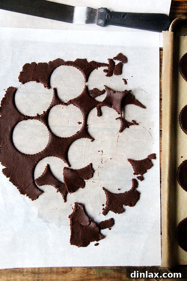 Precisely cut TKO cookie rounds using a fluted cutter, ready for baking into soft-batch chocolate cookies.