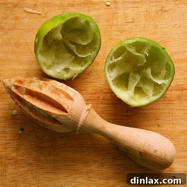 Close-up of fresh, vibrant mango-jicama slaw, featuring crisp jicama, sweet mango, red onion, chili peppers, and cilantro, dressed with lime.