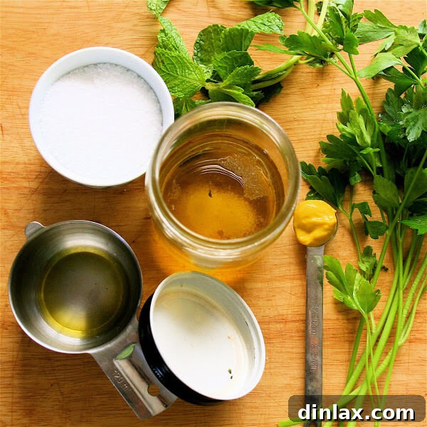 Summer Melon Cucumber Delight 4 A large bowl filled with mixed greens, diced cucumber, and colorful melon pieces, awaiting the mint vinaigrette.