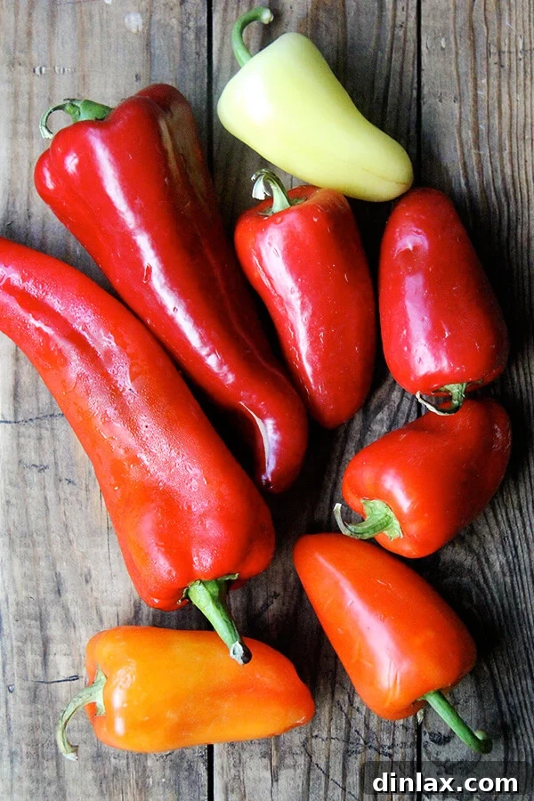 Prepare your peppers: A visual guide to the initial stage of making "Magic Peppers," showcasing the raw, colorful bell peppers before they undergo their effortless transformation in the oven. Fresh bell peppers, prepped and ready for roasting to become "Magic Peppers." The vibrant colors highlight their freshness, promising a delicious outcome with minimal effort.