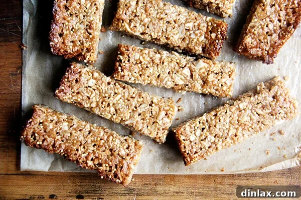 Homemade Granola Bars for Back-to-School 13 Several coconut almond granola bars arranged on a cutting board, ready to be enjoyed.