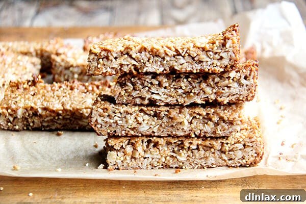 Homemade Granola Bars for Back-to-School 14 A stack of golden-brown coconut almond granola bars, ideal for back-to-school snacks.